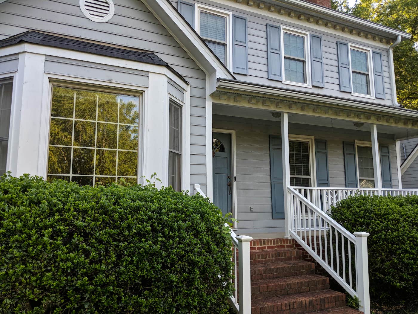 before image of a house in Apex, NC with old battered siding