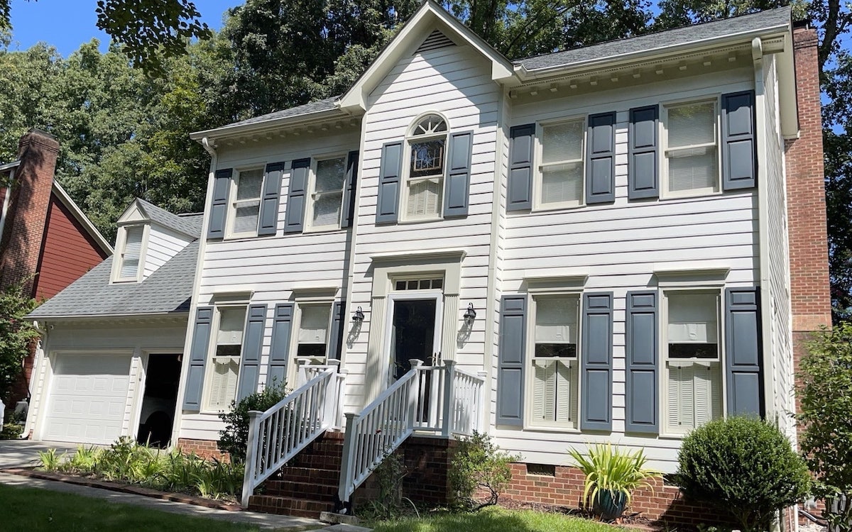 Home in Apex, NC, with old white siding