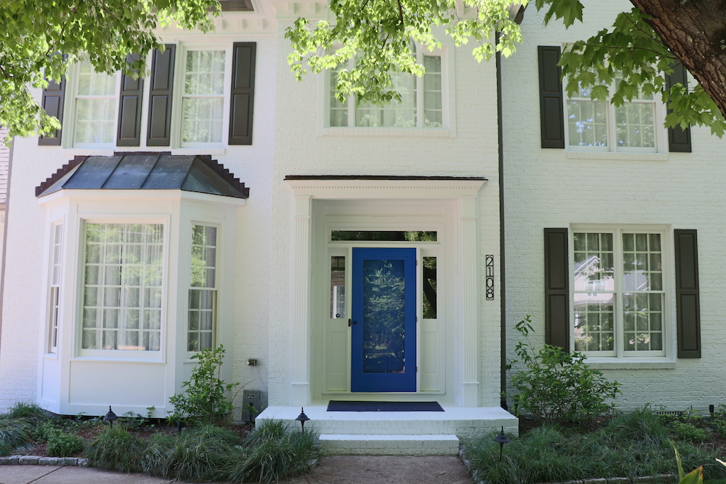 A blue door in Raleigh with a fresh coat of paint