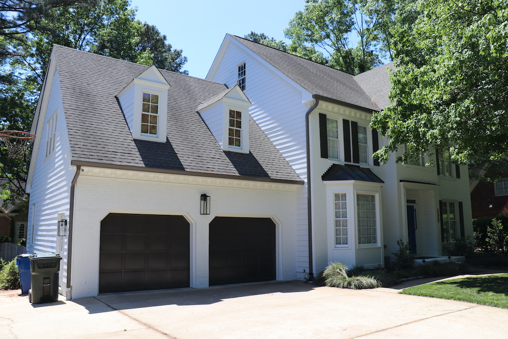 A garage with James Hardie siding in Raleigh with a fresh coat of white paint