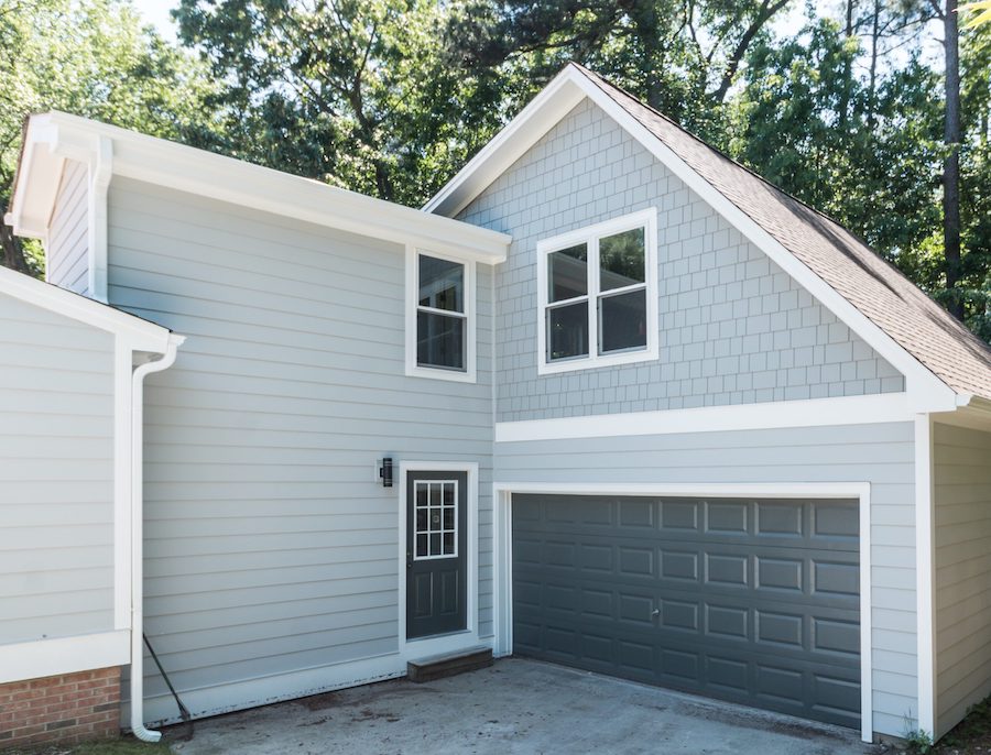 Newly installed light gray siding